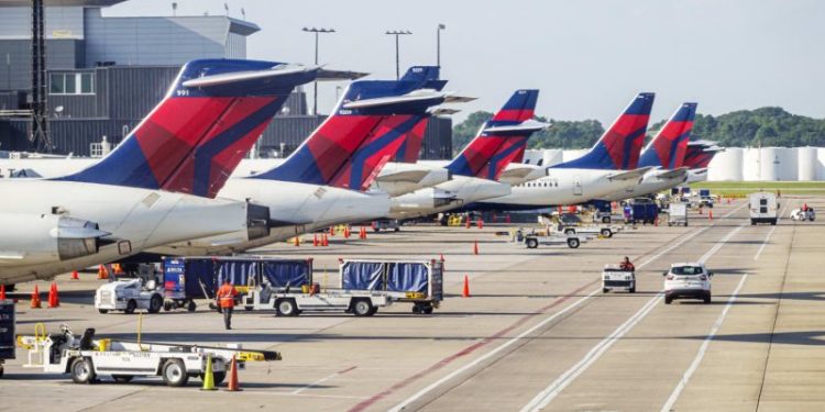 Delta cancels hundreds more flights as DOT opens probe