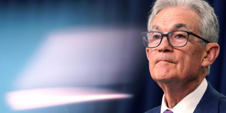 Fed holds interest rates but keeps door open to a cut in coming months