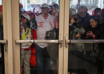 Trump fans endure frigid temps, sleet and snow for a chance to see president-elect