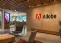 Adobe gains 3% as $25B buyback offsets AI concerns, stock slump
